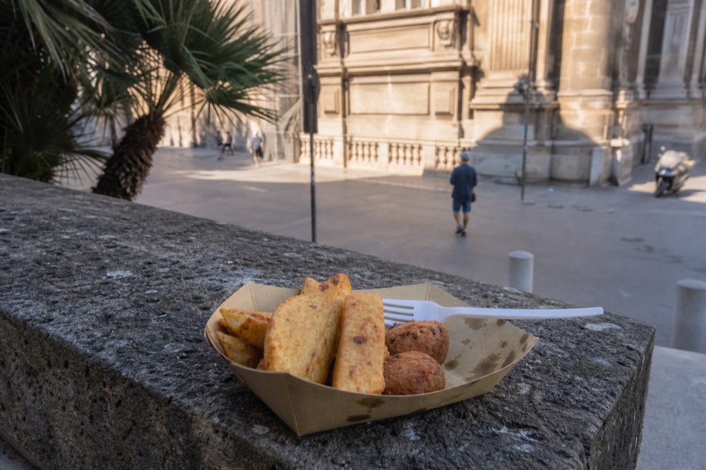 Chickpea panelle fritters and potato croquettes served in a paper tray